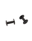 Two small black metal spool-shaped fasteners or hardware pieces on a plain white background.