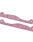 Two pink multitool handle scales with a colorful sprinkle pattern, displayed on a light gray background.