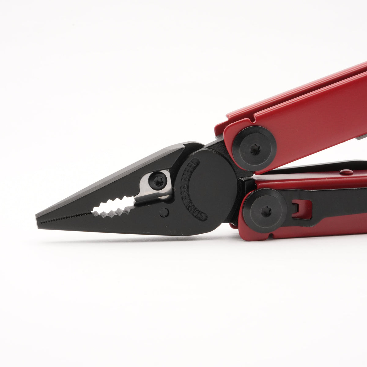 Red multi-tool with pliers extended on a white background.