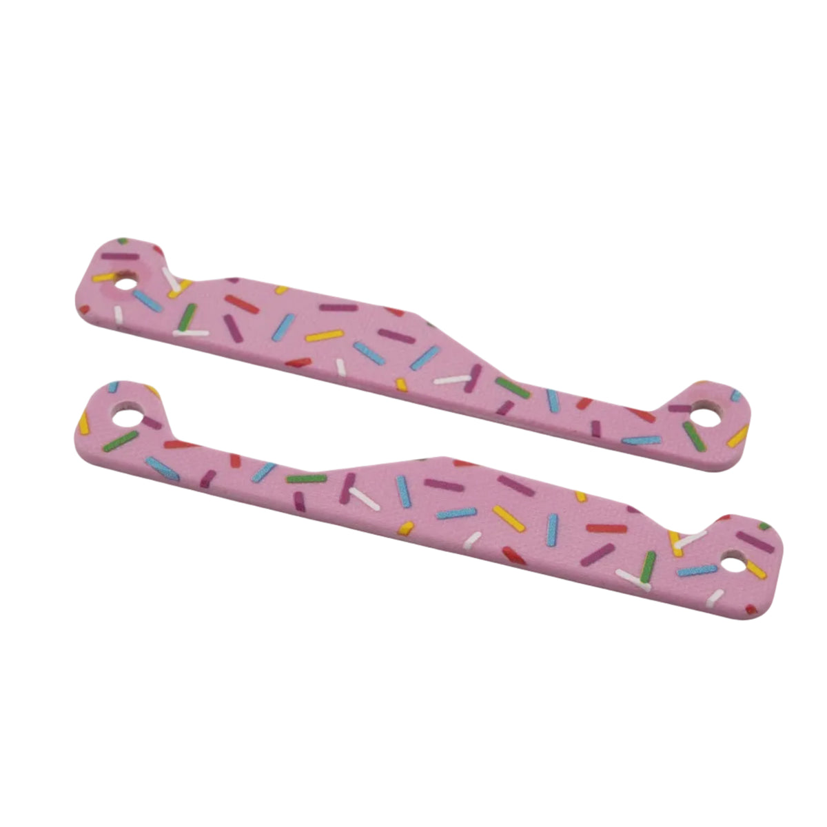 Two pink multitool handle scales with a colorful sprinkle pattern, displayed on a light gray background.